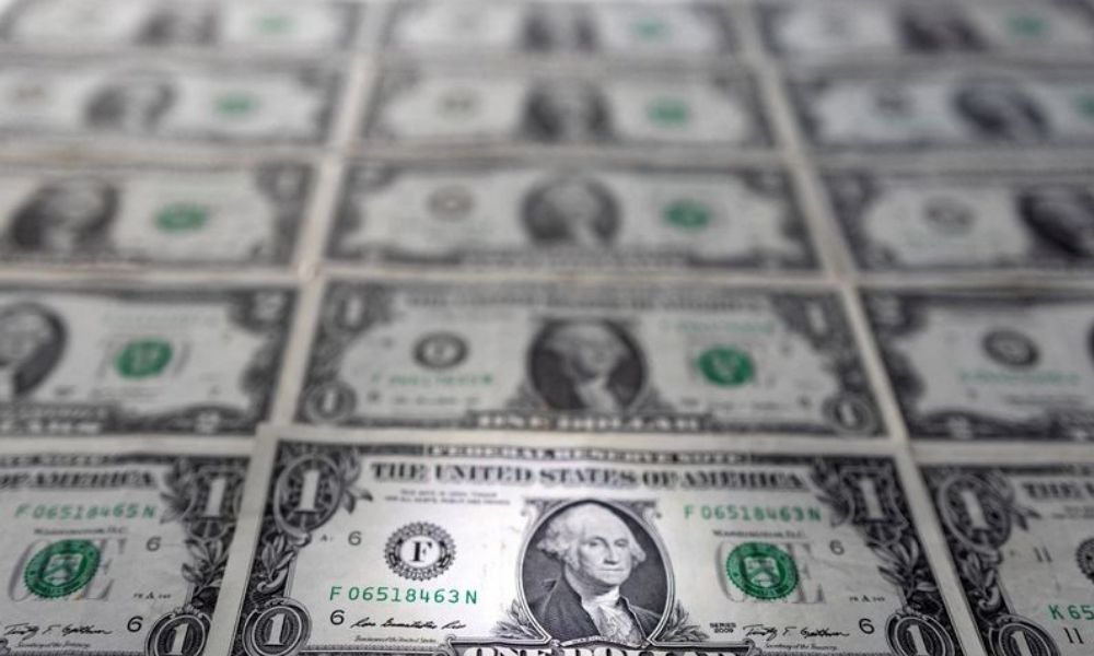 Dollar inches up to new two-year peak, set for best week in four